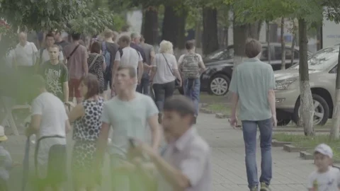 Crowd. People are walking along the crowded street of the city. Slow Motion Stock Footage