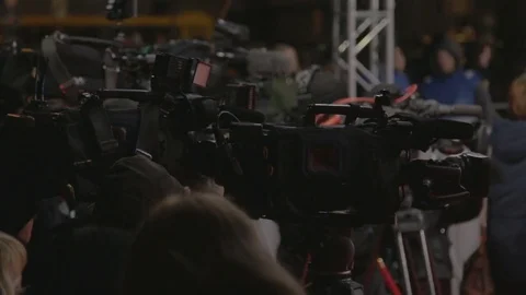 A crowd of people around black camera Stock Footage 73031400