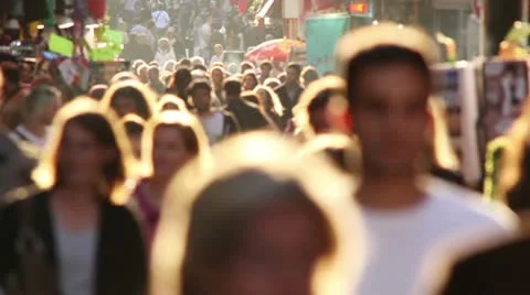 Crowd of people backlit by sun Stock Footage