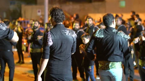 Crowd of people beating themselves lightly during Muharram, Iran, 4K, DNxHR Video stock 150158098