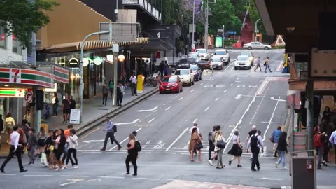 Crowd of people crossing at the intersection between Adelaide and Edward Stock Footage 220771036
