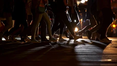 Crowd of people crossing the pedestrian while cars behind them stopped and Stock Footage 122003783