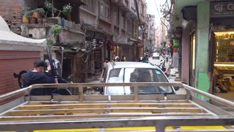 A crowd of people crossing in the tiny typical streets of Kathmandu, Nepal Video stock 295122656