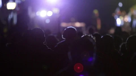 Crowd of people dancing, clapping hands and enjoying a concert with visual Stock Footage 99435372