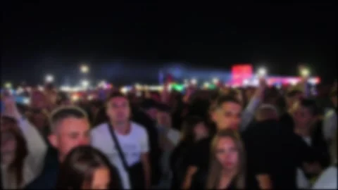 A crowd of people is dancing at a concert, background. Blurred, copy space for Stock Footage 243161718