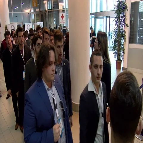 A crowd of people at the entrance of a fair Stock Footage