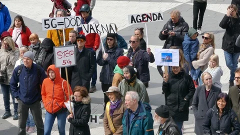 Crowd of people environmental activists demonstrations in street effects of 5G Stock Footage 112082176