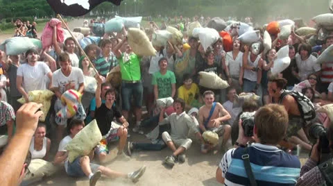 A crowd of people fighting pillows Stock Footage 25639623
