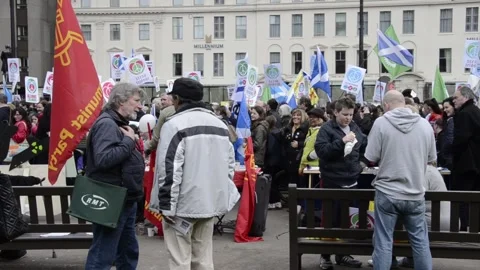 A crowd of people with flags at the Anti-Trident at George Square, Glasgow. Stock Footage 323282551