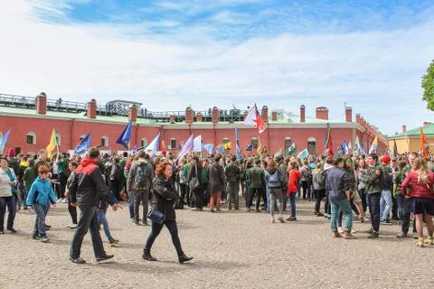 A crowd of people with flags. Stock Photos