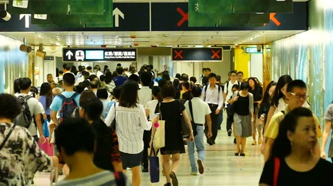 Crowd of people, going in and out forward, in tunnel of Central MTR subway Stock Footage 68170633