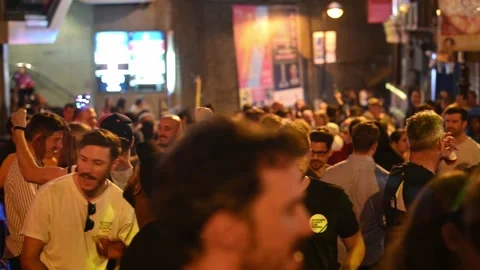 Crowd of people having fun at night on D'Aguilar Street in Hong Kong Stock Footage 151953516