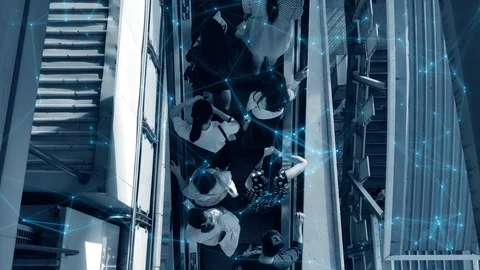 Crowd of people heading up using escalator to train station Stockbeeldmateriaal 110257696