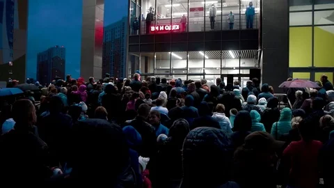 A crowd of people in a huge queue for prizes Stock Footage 80534864
