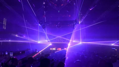 CROWD OF PEOPLE AT LASER SHOW IN DISCO Stock Footage 328282050