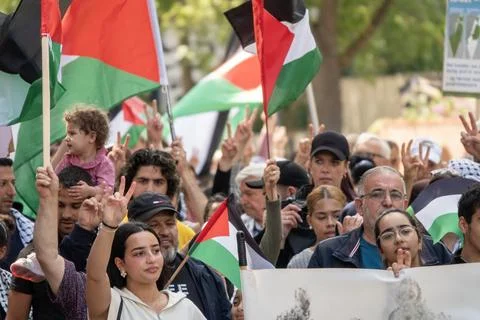 Crowd of people marching in demonstration for Palestine Stock Photos