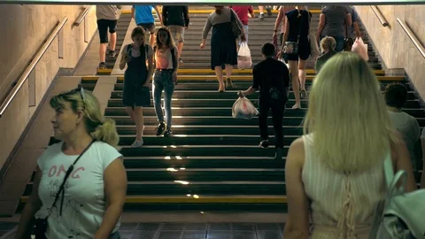 Crowd of people mostly women walk stairway to subway slow motion Busy city life Stock Footage