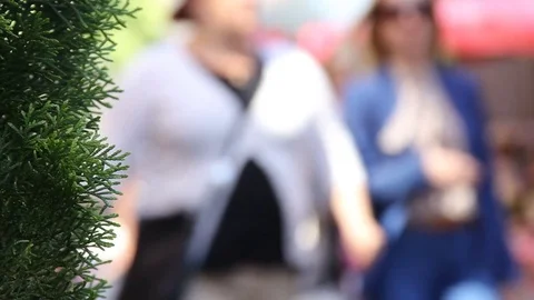 Crowd of people in multi colored clothes walking on a sunny day in the city.  3 Stock Footage 78000809