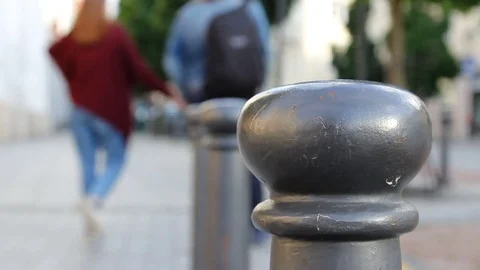 Crowd of people in multi colored clothes walking on a sunny day in the city. Video stock 79167438