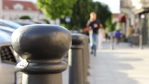 Crowd of people in multi colored clothes walking on a sunny day in the city. Video stock 79167983