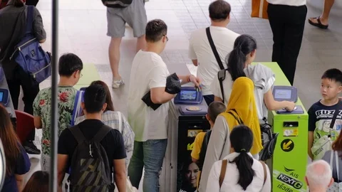 Crowd of people passing through ticket gate at BTS Siam Station Stock-Footage 115960029