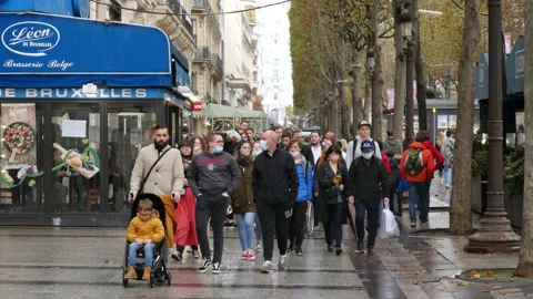 Crowd of People Pedestrians walk along Champs Elysees Street in Paris, autumn Stock Footage 164452853