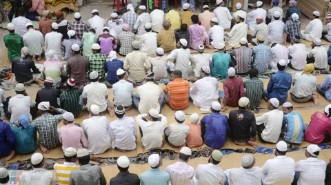 Crowd of people praying to Allah Stock Footage 60716875