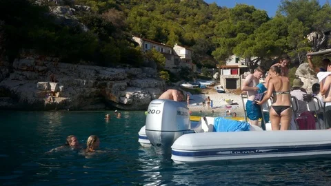 Crowd of people preparing for relaxing, sunbathing swimming on a boat Stock Footage 92103764