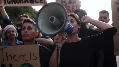 Crowd people protesting at climate change march for environment, social justice Stock Footage 315361544