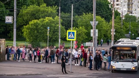 The crowd of people in the queue for the bus at rush hour  in the end of the  Stock Footage 155131127