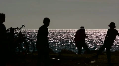 Crowd of people in the sea at sunset Stock Footage 65500617