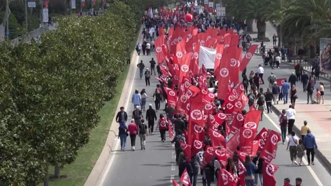 Crowd of people sing May Day march with placards and banners in hands Stock Footage 194960572