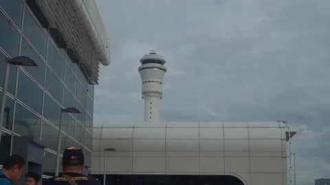 Crowd of people at smoking zone in Kuala Lumpur International Airport. Stock Footage 101068922