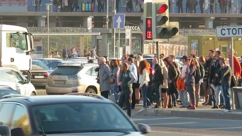 A crowd of people standing at the intersection, Stock Footage 107970313
