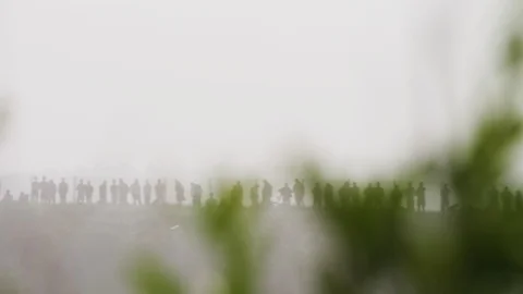 Crowd of people standing on mountain Stock Footage 98629072