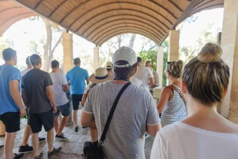 Crowd of people standing in the queue rear view Stock Photos