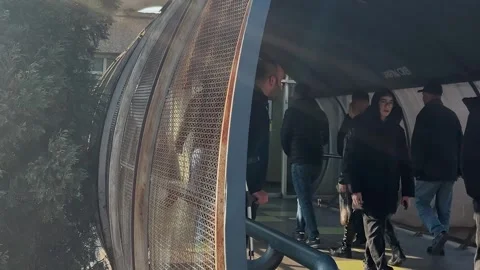 Crowd of people though via overhead bridge, subway passengers Video stock 323651711