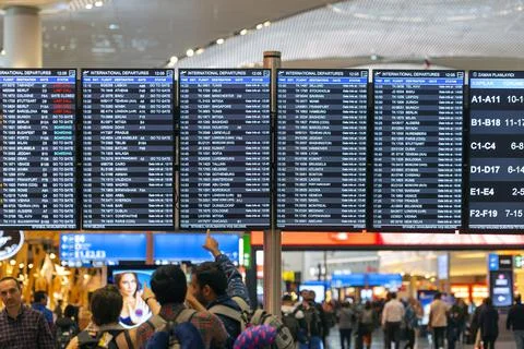 Crowd of people at the timetable board at the airport Havalimani in Istanbul Stock Photos