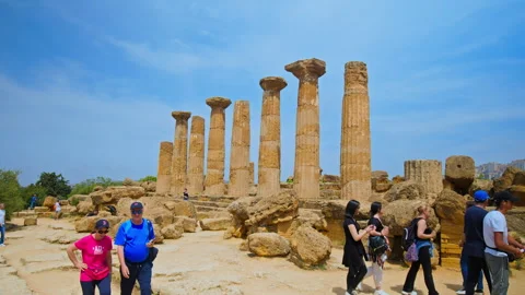 A crowd of people visits the antique Temple of Heracle in Sicily, Italy. Stock Footage 244344747