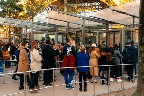 Crowd of people waiting to Eiffel Tower Paris Stock Photos