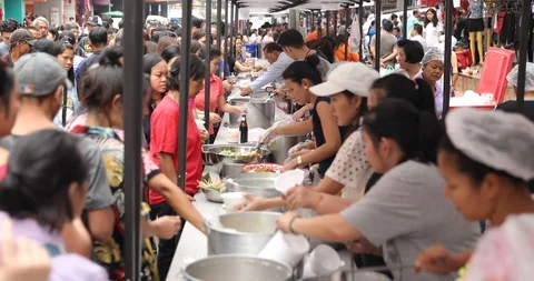 Crowd of People Waiting in Queue at Chinese Street Food Festival in Bangkok City Stock Footage 96744915