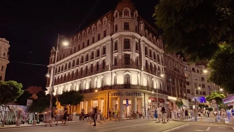Crowd of people walk on closed streets pedestrian only street, night time-lapse Stock Footage 315087929