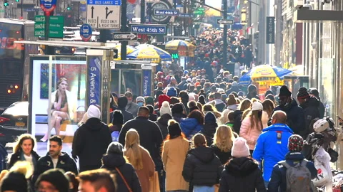 A crowd of people walk down on the Fifth Avenue during holiday NYC 2021 Stock Footage 167446579