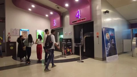 Crowd of People walk into movie theatre ... | Stock Video | Pond5