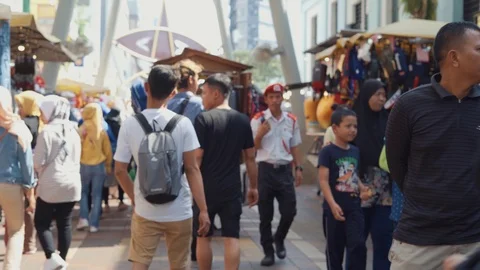 Crowd of people walking along at Pasar Seni. Stock Footage 105293884