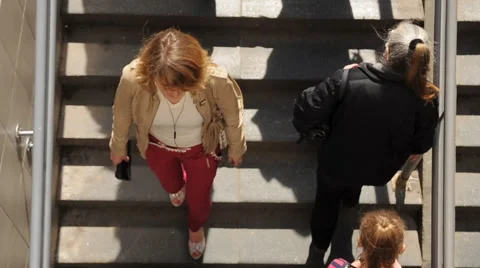 Crowd of people walking up and down the stairs Video stock 61325076