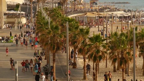 Crowd Of People Walking On Beach Sidewalk  - Long shot Stock Footage 75344674