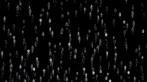Crowd of people walking in a dark background. Large group moving together. Stock Footage 313652158