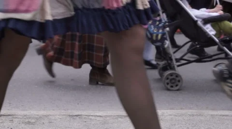 A crowd of people walking down the street 库存影片 62948617