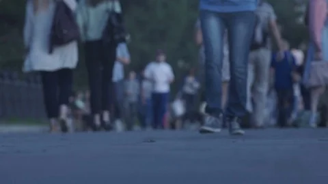 A crowd of people walking down the street Stock Footage 78015595